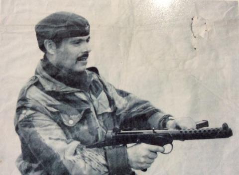 OS Raymond H Banner in smock and beret with Sterling SMG