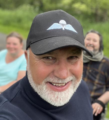 OS Thomas K Noble wearing wings baseball cap