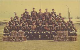 Colour image of the 1st battalion Band with their drums stacked.