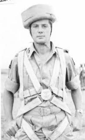 John B Sanderson wearing parachute and 'sorbo' helmet, India