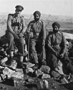 John B Sanderson on mountain O.P with two Sikh colleagues
