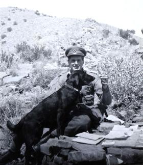 John B Sanderson with regimental mascot Susan, 1945