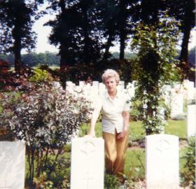 Pte Cartmans sister at his grave, 1980s.