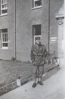 Sapper Brian Guest with bicycle outside barracks