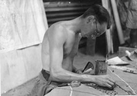 1st Airborne Division Artist constructing a planning board for a forthcoming operation. 