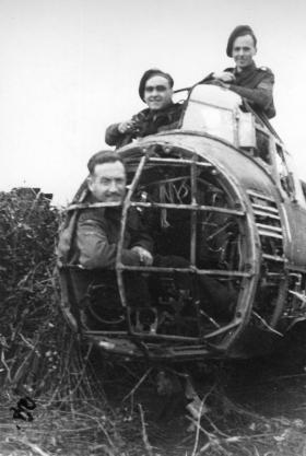 Beja 1942 German Ju88 shot down with Bren gun fire crew posing the wreckage.