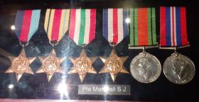 Colour image of the medals of Sydney Marshall on display in the Airborne Assault Museum