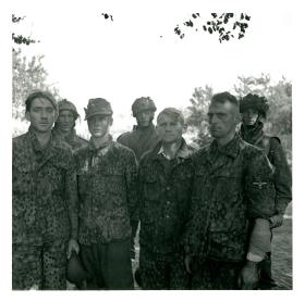 Four German SS prisoners are brought into the Divisional POW cage by glider pilots. 