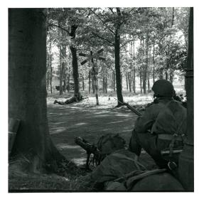 Men of 1st Airborne Reconnaissance Sqn securing crossroads near Wolfheze. PIAT gun in foreground.