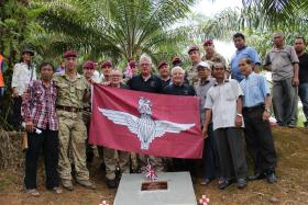 Members of 2 PARA past and present with Maj Gen Bashall CBE and Wo2 Phil Stout with villagers of Plaman Mapu, 2015.