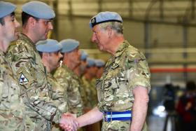 A member of 3 Regt AAC receives his OSM from HRH Prince of Wales, Wattisham, 9 May 2013.