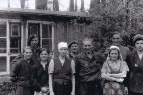 Ptes Piercey, Salter and Murray with liberated Polish slave workers, April 1945.