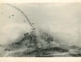 German parachutists landing and a Ju52 on fire, Crete.