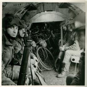 Men of 249 Field Company sit in glider with bicycles.