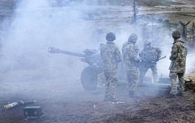 Airborne gunners take part in a direct fire mission using a 105mm Light Gun, Exercise Eagles Resolve 12, Warcop, 2012.