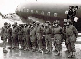 Members of 12th Para Bn form up by a Dakota aircraft, undated.