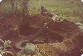 Pte Crichton of A Coy, 4 PARA Mortars beside the mortar pit on exercise in Minnesota, 1983