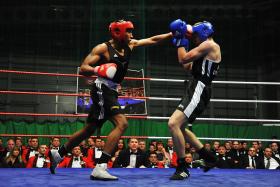 Pte Barry (red gloves) in the semi-final of the Army Major Units Boxing Championship, Colchester, 29 February 2012.