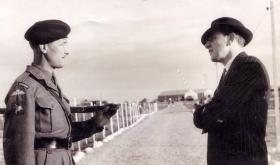 RSM Alcock talks to fellow past guardsman, Cyprus, c1956.