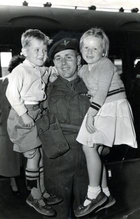  Peter Malone saying goodbye to two of his children, Aldershot train station on the way to Suez, 1956.