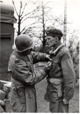 Brig Hill, wearing a Windak Air Ministry smock, being decorated with the Silver Star by Gen Ridgeway, 1945.