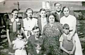 'Bobby' Evans with his Mam, Dad, brothers and sisters at the family home in Penrhiwceiber, South Wales, late 1930s