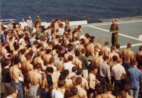 Padre Cooper holding a service, MV Norland, 1982