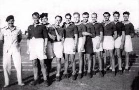 Group photograph of 716 Lt Comp Coy Tug-o-war team, Haifa, Palestine