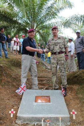 Gil Boyd BEM and Major General Bashall CBE with the plaque on the site of Plaman Mapu, 27 April 2015.