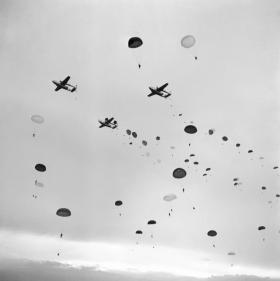 Paratroopers of 16 Airborne Division jump on Ex King's Joker from a vic of American C119s September 1953