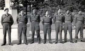 Peter Malone with others at Oosterbeek Cemetery, c1950s.