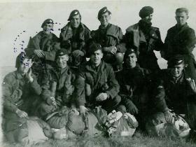 Members of 5th (Scottish) Parachute Bn on a DZ with field packed parachutes c1947