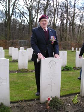 Mr L Rooke at the grave of Maj C Vickery, Reichswald Cemetery, 31 Mar 2010.