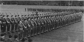Trooping the Colour parade at attention, Barrosa Square,Aldershot 1958.