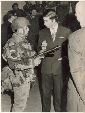 Prince Charles being shown shown a Sterling SMG by a L/Cpl of A Coy 4 PARA at Pudsey, 1970