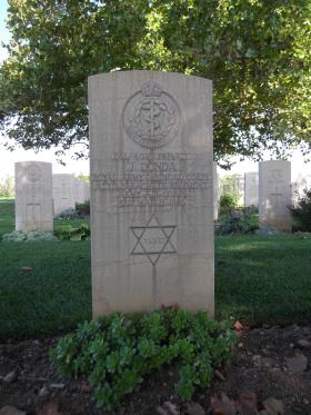 Headstone of Pte J Donda, Bari War Cemetery, November 2011.