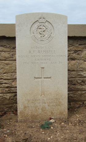 Headstone of L/Cpl R Russell, Ranville Churchyard, August 2010.