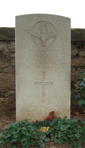 Headstone of Pte P Lockett, Ranville Churchyard, August 2010.