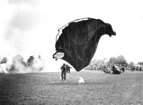 A member of the Parachute Regiments Freefall Team landing at a public display, 1964