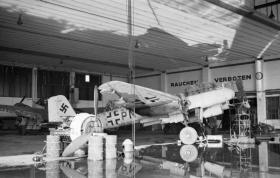 A captured Junkers Ju 88 aircraft in a hangar at Wunstorf airfield, April 1945.