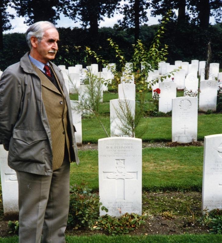 Ex Member of C troop and comrade of David Plummer stands by Grave