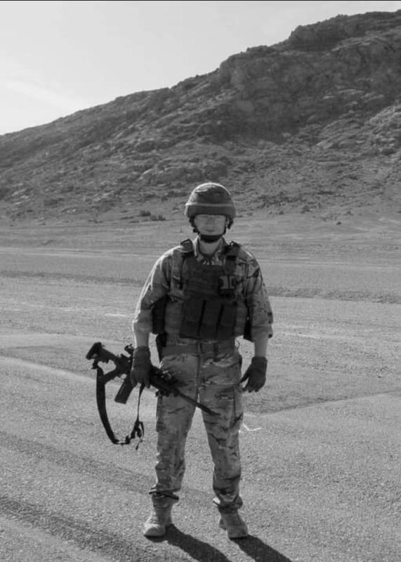 OS M Flynn carrying rifle wearing helmet and googles