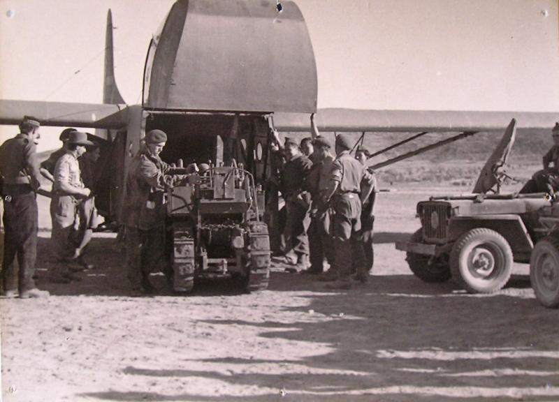 Clark CA-1 airborne bulldozer being loaded onto a WACO glider. Greece 1944.