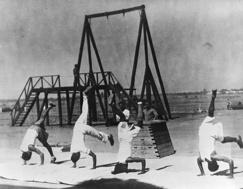 Acrobatic shot of Indian paratroopers in training 