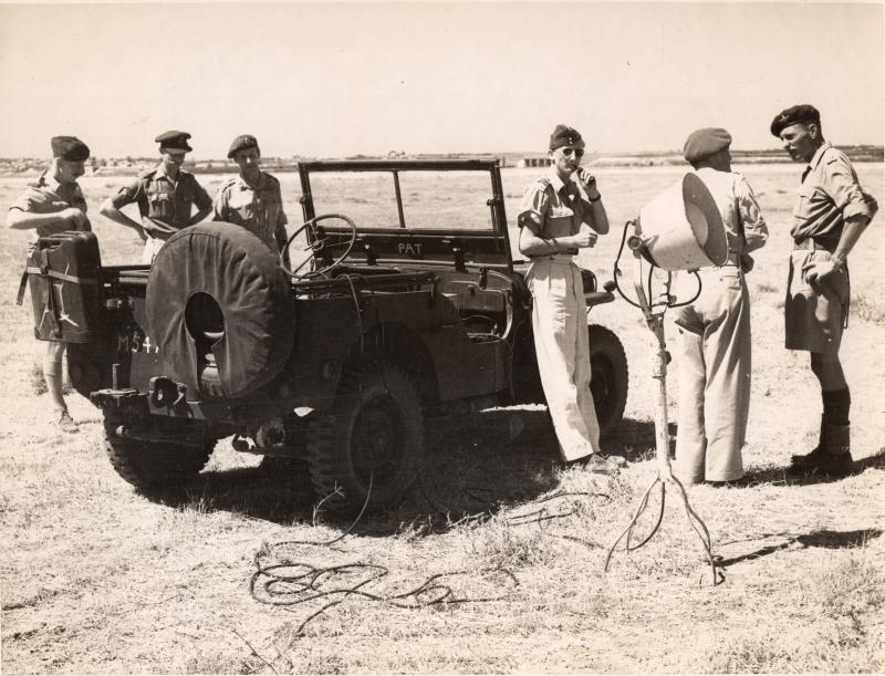 Lieutenant Colonel Allen Parry in Palestine next to a jeep