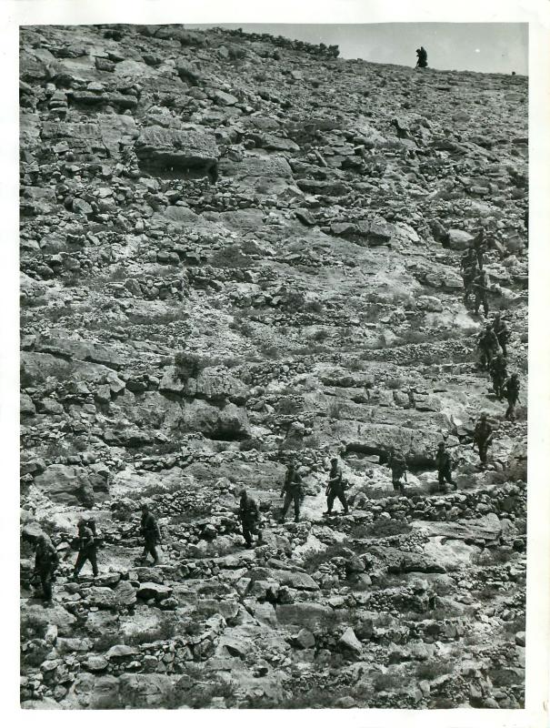 3 PARA soldiers move across typically difficult terrain in the Radfan mountains, May 1964.