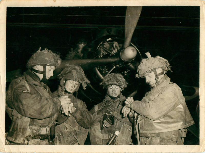 British paratroopers synchronise their watches in front of an Armstrong Whitworth Albemarle.
