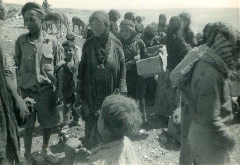 Members of 3 PARA give water to refugess in Amman, Jordan 1958 P2