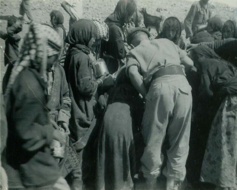 Members of 3 PARA give water to refugess in Amman, Jordan 1958 P3